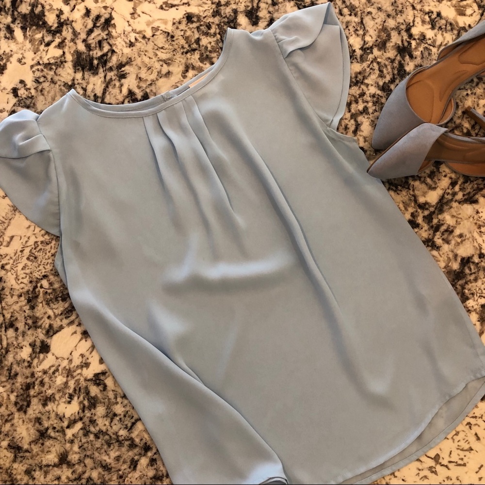 Blue Blouse, a button in the back, medium M